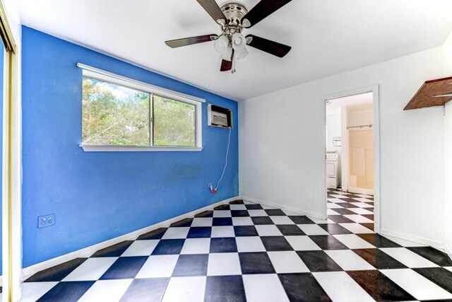 3701 Fischer Store Rd, Wimberley, TX 78676 - spare room with an AC wall unit, baseboards, a ceiling fan, and tile patterned floors