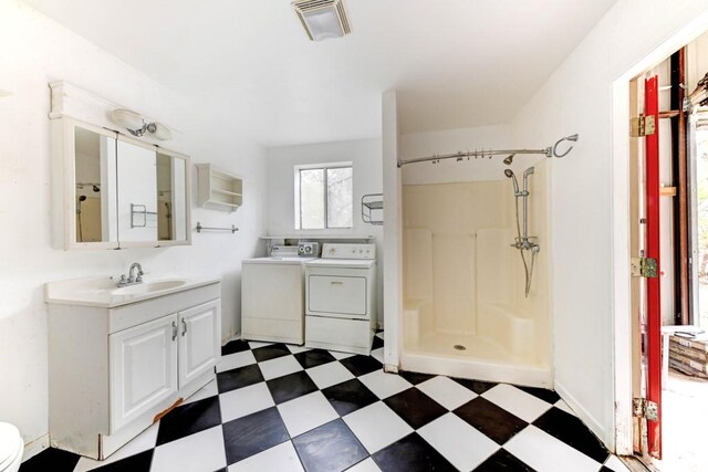 3701 Fischer Store Rd, Wimberley, TX 78676 - full bathroom featuring a walk in shower, tile patterned floors, visible vents, independent washer and dryer, and vanity