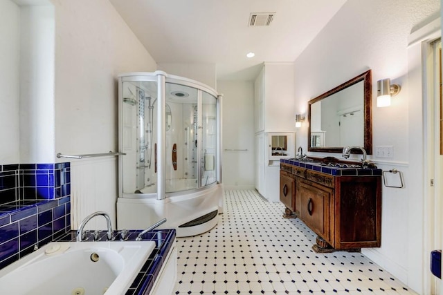 3701 Fischer Store Rd, Wimberley, TX 78676 - full bath featuring a stall shower, vanity, a whirlpool tub, and visible vents