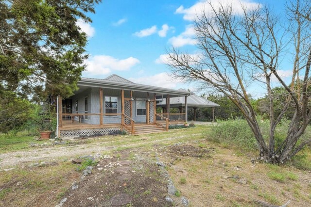 3701 Fischer Store Rd, Wimberley, TX 78676 - farmhouse inspired home featuring metal roof and a porch