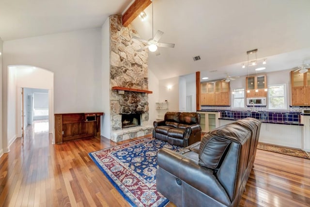 3701 Fischer Store Rd, Wimberley, TX 78676 - living area with a ceiling fan, light wood-type flooring, and arched walkways