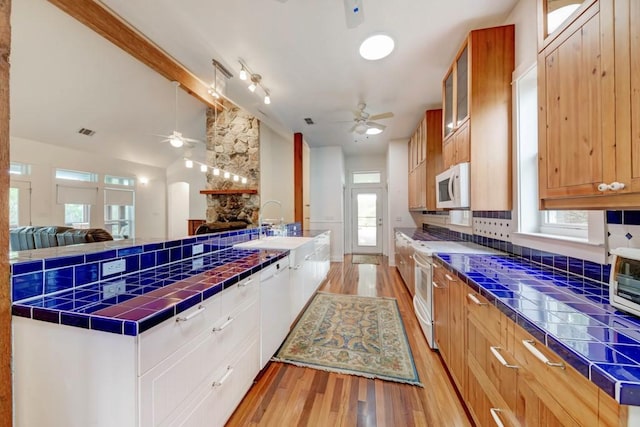 3701 Fischer Store Rd, Wimberley, TX 78676 - kitchen with white appliances, open floor plan, ceiling fan, and a sink