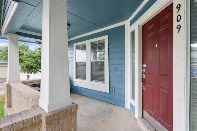 doorway to property featuring covered porch