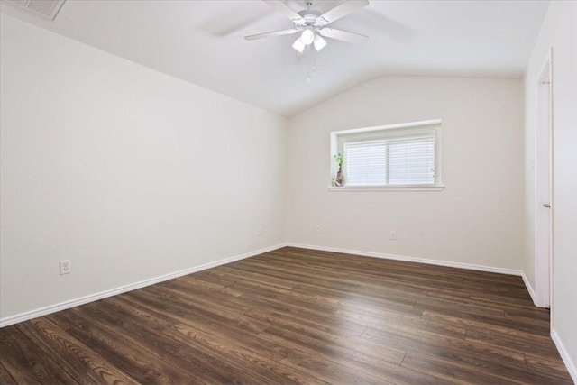 unfurnished room with lofted ceiling, visible vents, dark wood finished floors, ceiling fan, and baseboards