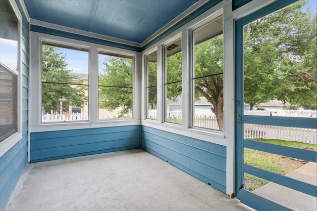 unfurnished sunroom featuring plenty of natural light