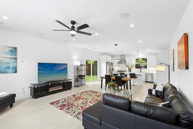 1500 Sylvan Glade Rd Unit 1A, Austin, TX 78745 - living room with light wood-style flooring, recessed lighting, and ceiling fan