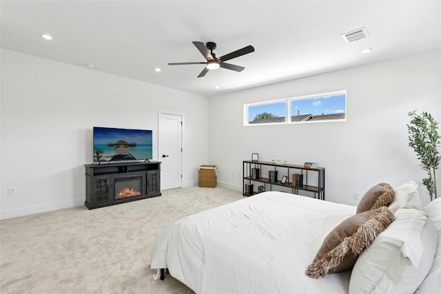 1500 Sylvan Glade Rd Unit 1A, Austin, TX 78745 - bedroom with recessed lighting, a glass covered fireplace, carpet flooring, and a ceiling fan