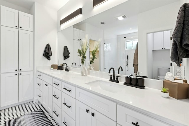 1500 Sylvan Glade Rd Unit 1A, Austin, TX 78745 - full bathroom featuring double vanity, a shower stall, and tile patterned flooring