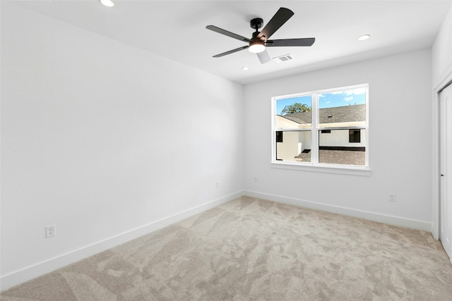 1500 Sylvan Glade Rd Unit 1A, Austin, TX 78745 - spare room with light carpet, ceiling fan, and recessed lighting
