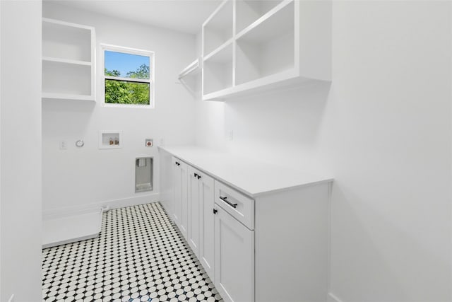 1500 Sylvan Glade Rd Unit 1A, Austin, TX 78745 - laundry area featuring hookup for an electric dryer, hookup for a gas dryer, washer hookup, and cabinet space