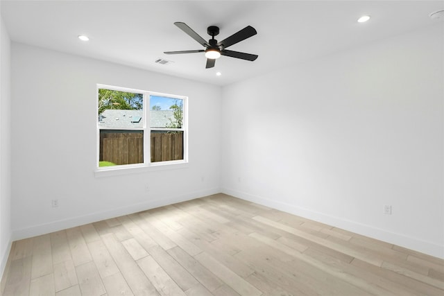 1500 Sylvan Glade Rd Unit 1A, Austin, TX 78745 - spare room featuring light wood-type flooring, a ceiling fan, and recessed lighting