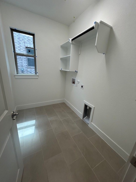 565 Raleigh Dr, Georgetown, TX 78633 - clothes washing area with electric dryer hookup, washer hookup, baseboards, and hookup for a gas dryer