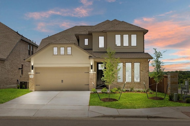 565 Raleigh Dr, Georgetown, TX 78633 - view of front of home featuring concrete driveway, a shingled roof, stucco siding, and an attached garage