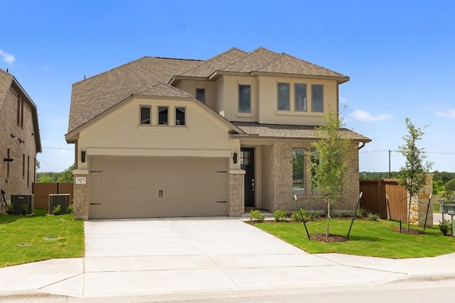 565 Raleigh Dr, Georgetown, TX 78633 - view of front of home with stucco siding, roof with shingles, and concrete driveway