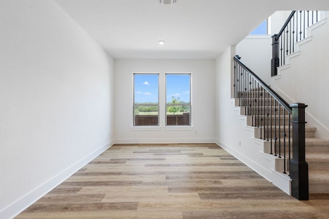 565 Raleigh Dr, Georgetown, TX 78633 - spare room with stairs and light wood-type flooring