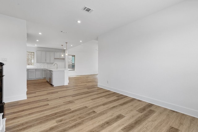565 Raleigh Dr, Georgetown, TX 78633 - unfurnished living room with recessed lighting and light wood-type flooring