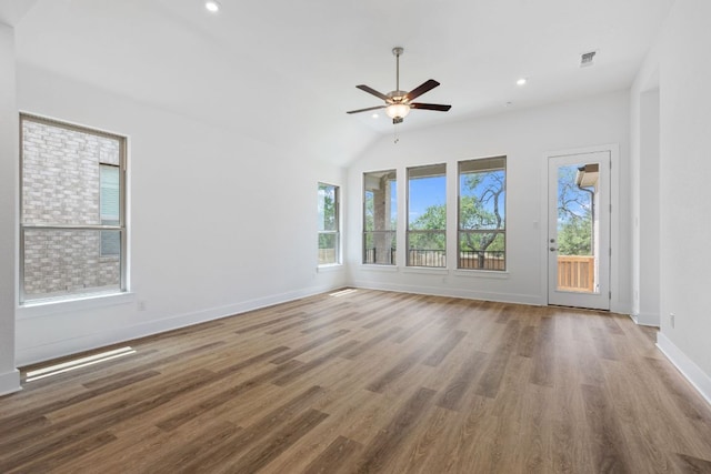 565 Raleigh Dr, Georgetown, TX 78633 - empty room featuring plenty of natural light, wood finished floors, ceiling fan, recessed lighting, and lofted ceiling