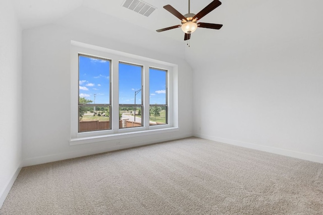 565 Raleigh Dr, Georgetown, TX 78633 - spare room featuring carpet, ceiling fan, and vaulted ceiling
