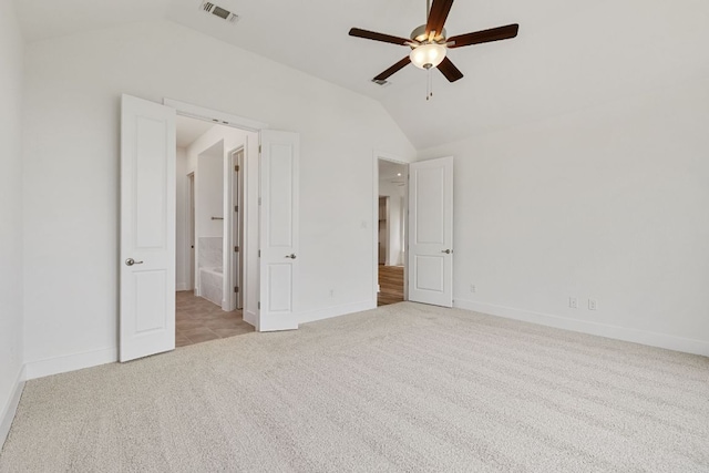 565 Raleigh Dr, Georgetown, TX 78633 - unfurnished bedroom featuring vaulted ceiling, carpet flooring, connected bathroom, and ceiling fan