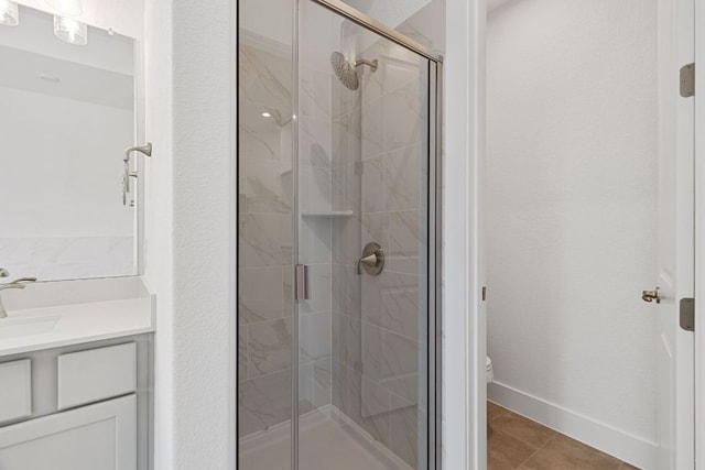 565 Raleigh Dr, Georgetown, TX 78633 - bathroom with a shower stall, vanity, and tile patterned floors