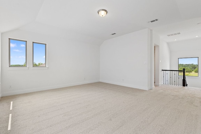 565 Raleigh Dr, Georgetown, TX 78633 - unfurnished room featuring lofted ceiling and light carpet