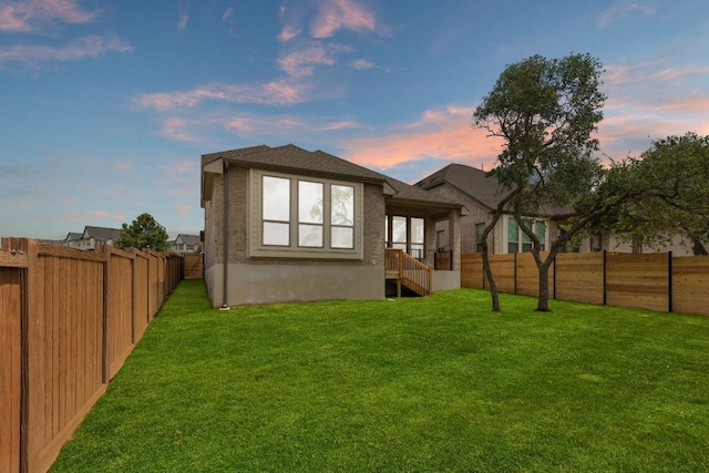 565 Raleigh Dr, Georgetown, TX 78633 - rear view of house with a fenced backyard