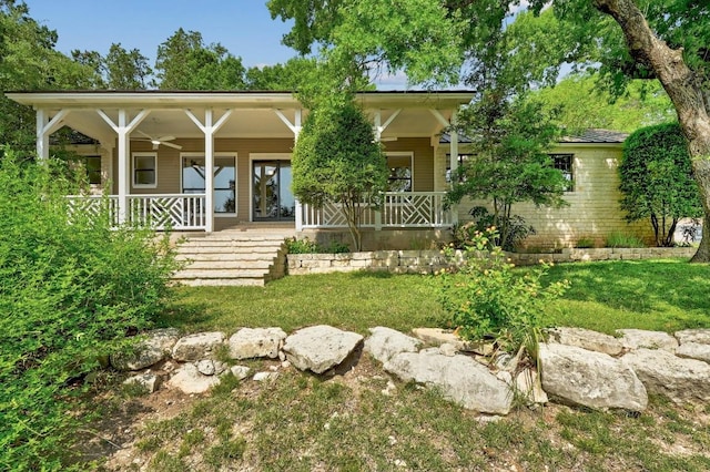 exterior space featuring a ceiling fan and covered porch