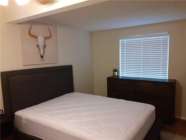 bedroom featuring wood finished floors