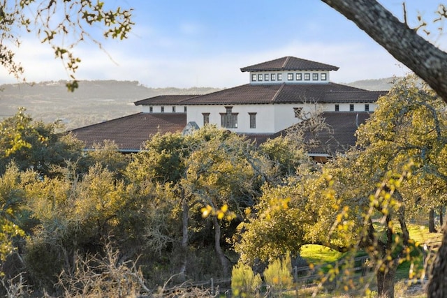18700 Madrone Ranch Trl, Austin, TX 78738 - exterior space featuring stucco siding and a tiled roof