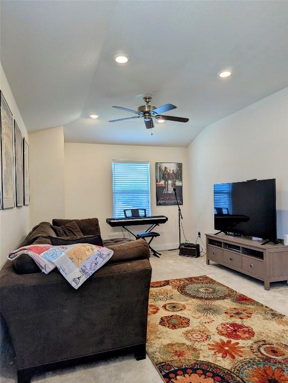 7617 Rio Pass, Austin, TX 78724 - living room with a ceiling fan, vaulted ceiling, and recessed lighting