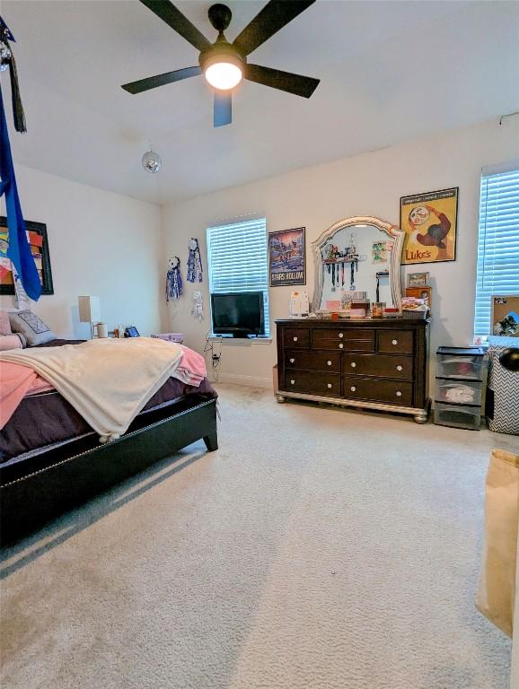 7617 Rio Pass, Austin, TX 78724 - carpeted bedroom featuring ceiling fan