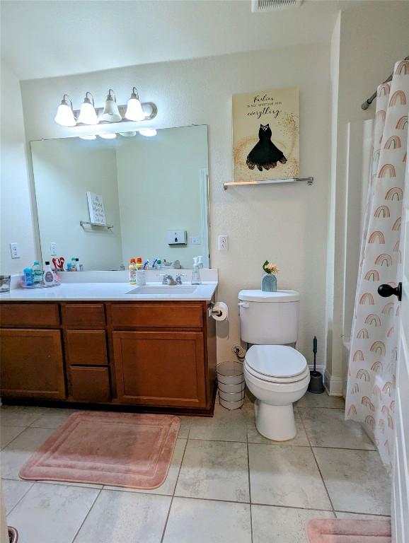 7617 Rio Pass, Austin, TX 78724 - full bathroom with double vanity and toilet
