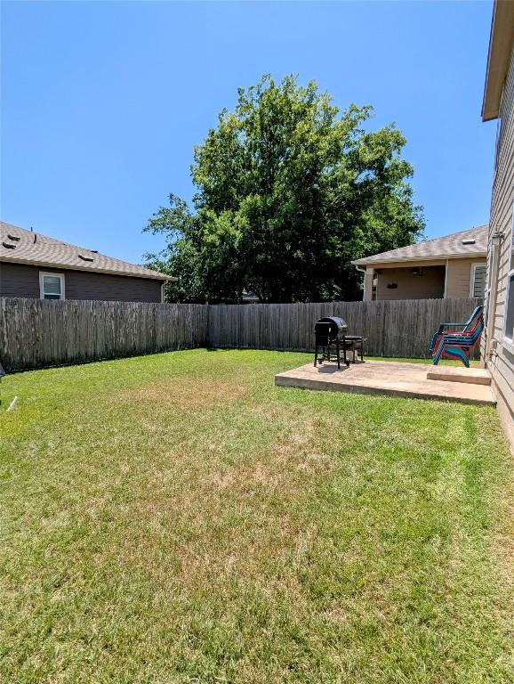 7617 Rio Pass, Austin, TX 78724 - fenced backyard with a patio area