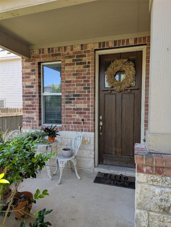 7617 Rio Pass, Austin, TX 78724 - property entrance with a porch and brick siding