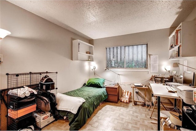 803 W 28th St Unit 105, Austin, TX 78705 - bedroom with a textured ceiling