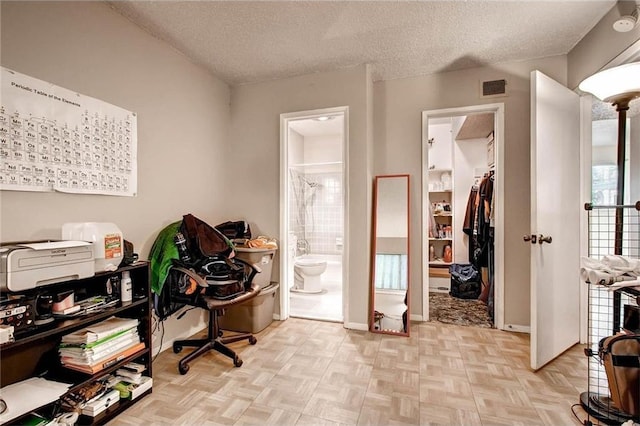 803 W 28th St Unit 105, Austin, TX 78705 - office featuring baseboards, visible vents, and a textured ceiling