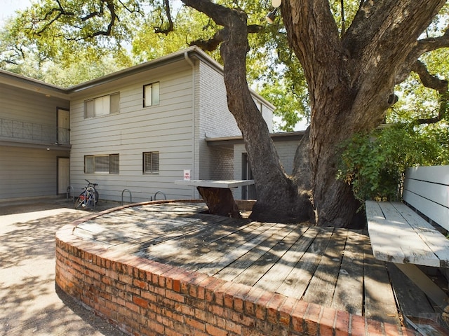 803 W 28th St Unit 105, Austin, TX 78705 - exterior space featuring a deck and brick siding