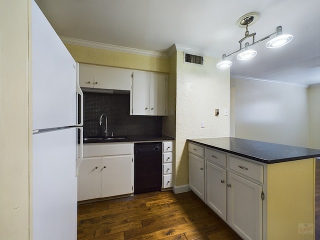 803 W 28th St Unit 206, Austin, TX 78705 - kitchen with black dishwasher, a peninsula, freestanding refrigerator, ornamental molding, and dark countertops