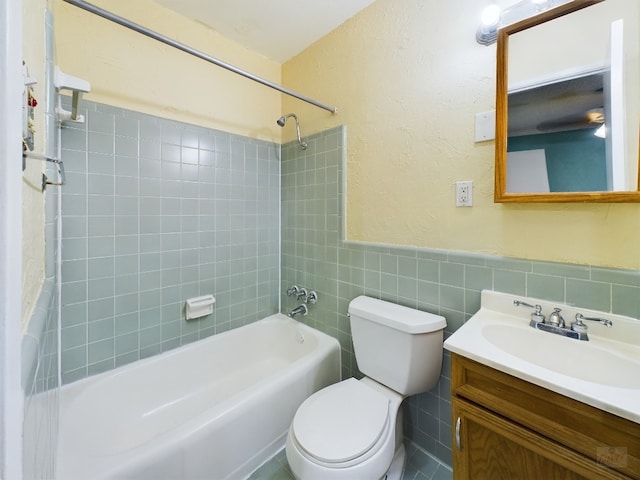 803 W 28th St Unit 206, Austin, TX 78705 - full bathroom with toilet, shower / bath combo with shower curtain, a wainscoted wall, a textured wall, and vanity