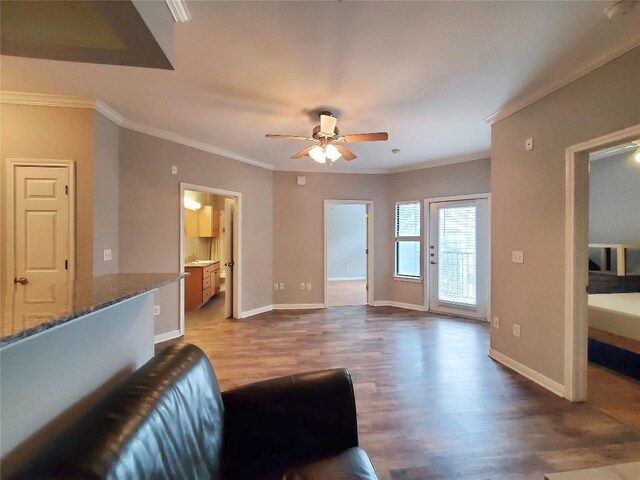 2502 Leon St Unit 515, Austin, TX 78705 - living area featuring baseboards, crown molding, ceiling fan, and wood finished floors