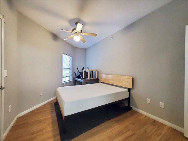 2502 Leon St Unit 515, Austin, TX 78705 - bedroom with baseboards, ceiling fan, and wood finished floors
