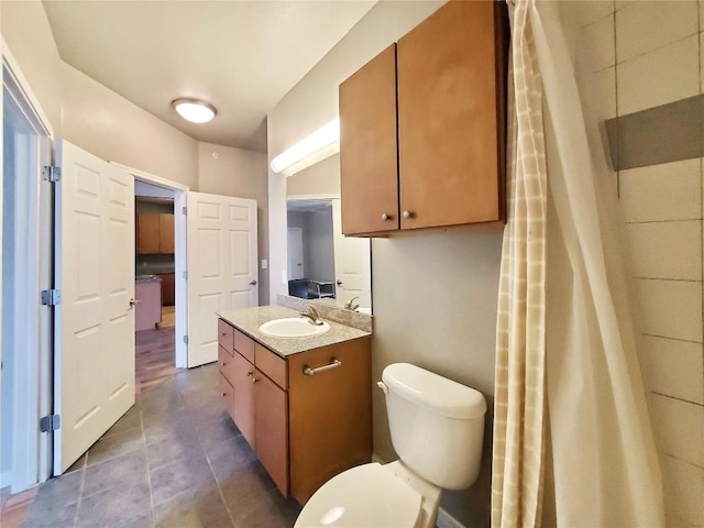 2502 Leon St Unit 515, Austin, TX 78705 - bathroom with vanity, toilet, and tile patterned floors