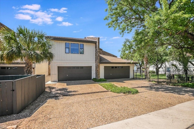 402 Island Dr Unit C, Horseshoe Bay, TX 78657 - view of front facade with a chimney, driveway, a tile roof, and fence