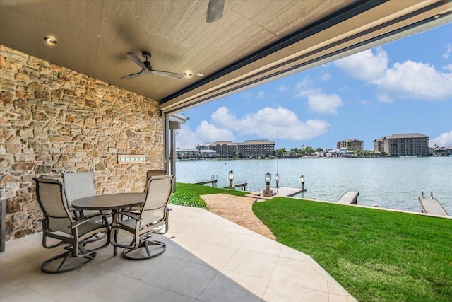 402 Island Dr Unit C, Horseshoe Bay, TX 78657 - view of patio with ceiling fan, a water view, outdoor dining space, and a dock