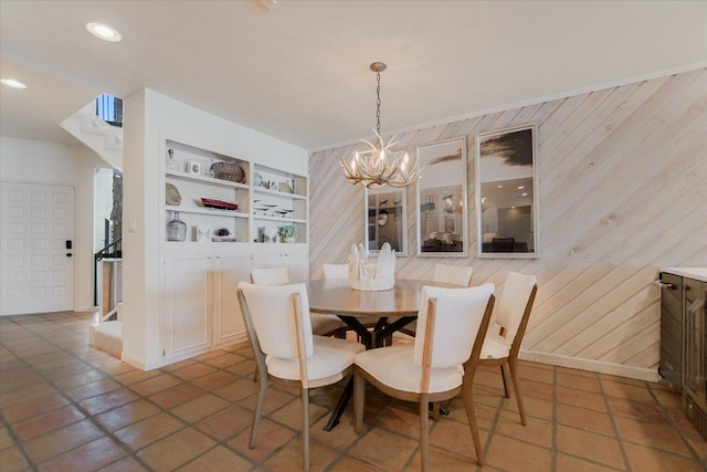 402 Island Dr Unit C, Horseshoe Bay, TX 78657 - dining area with built in features, wood walls, and a notable chandelier