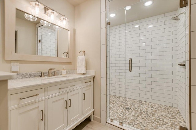 402 Island Dr Unit C, Horseshoe Bay, TX 78657 - bathroom featuring a stall shower, vanity, and recessed lighting