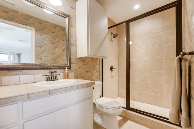 402 Island Dr Unit C, Horseshoe Bay, TX 78657 - full bathroom with a stall shower, toilet, visible vents, tile patterned flooring, and vanity