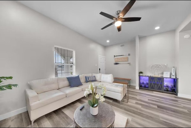 102 W Corral St Unit 2, South Padre Island, TX 78597 - living area with wood finished floors, visible vents, baseboards, and a ceiling fan