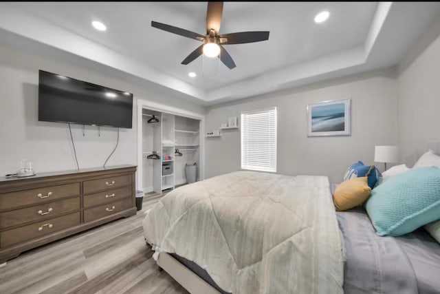 102 W Corral St Unit 2, South Padre Island, TX 78597 - bedroom featuring a closet, recessed lighting, a walk in closet, a raised ceiling, and light wood-style floors