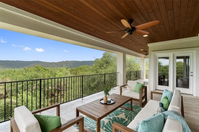 1300 Morning Moon Cir, Austin, TX 78732 - balcony with an outdoor living space, a view of trees, and ceiling fan
